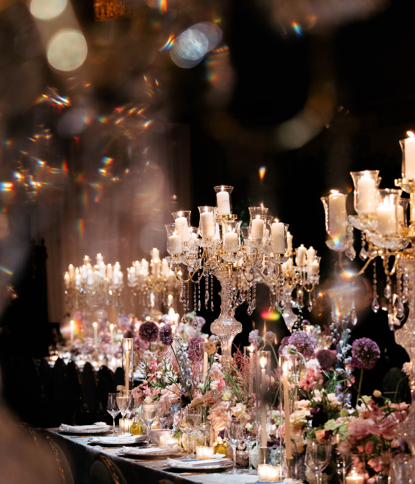 Elegant crystal candelabras and romantic candlelit florals create a dreamlike reception ambiance perfectly suited for immersive ReLOOM VR experiences.